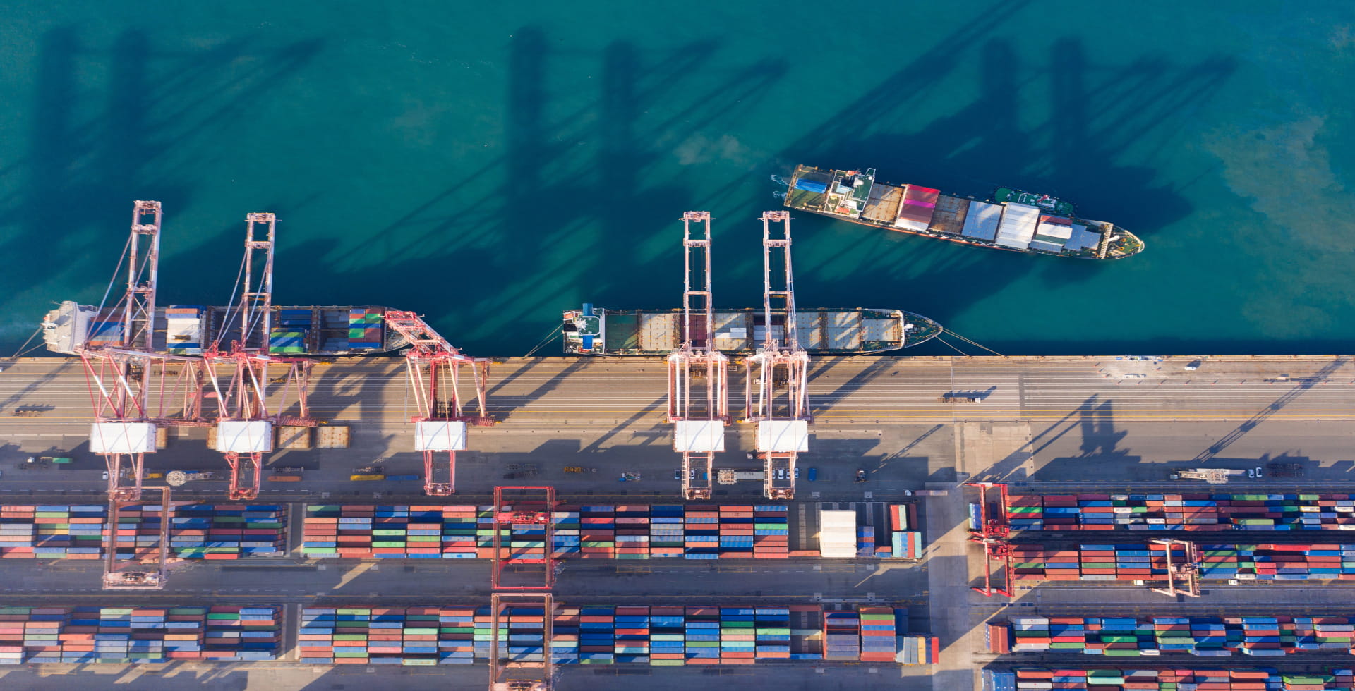 Aerial view sea port warehouse and container ship or crane ship working for delivery containers shipment.